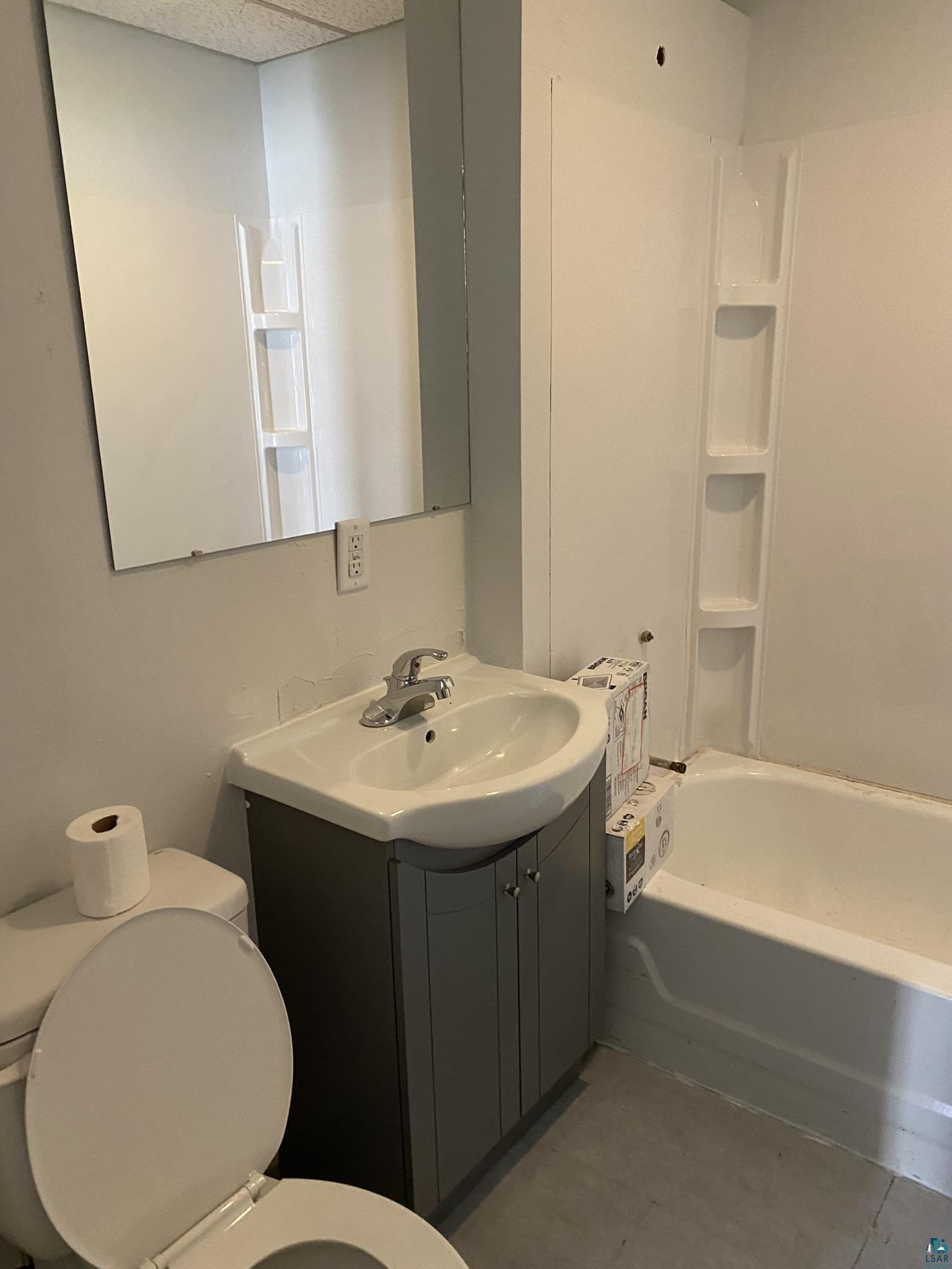 2967 Exeter Street Duluth, MN 55806 - Photo 30 of 31 Full bathroom with toilet, vanity, and tub / shower combination
