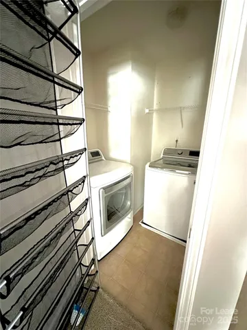a kitchen with a stove and white cabinets