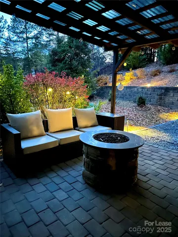 a view of swimming pool with outdoor seating