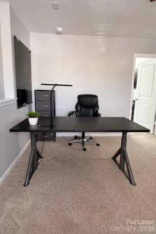 a view of a workspace with furniture