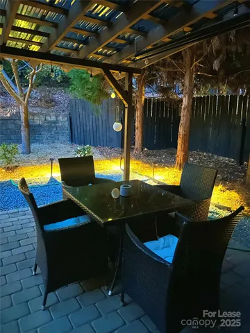 a view of a swimming pool with a patio