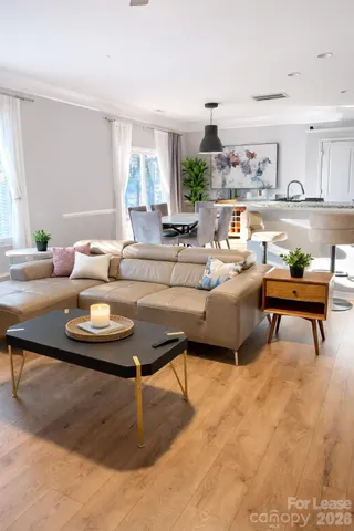 a living room with furniture and a table