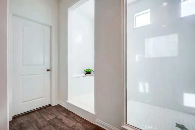 a view of a patio with table and chairs with wooden floor and fence