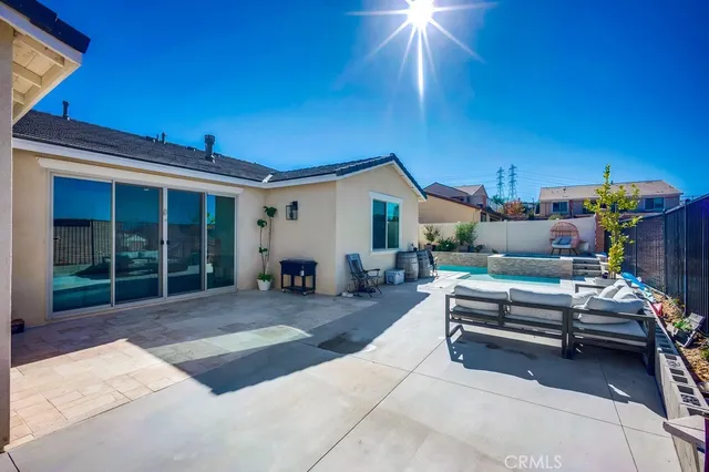 a view of a house with swimming pool in front of it
