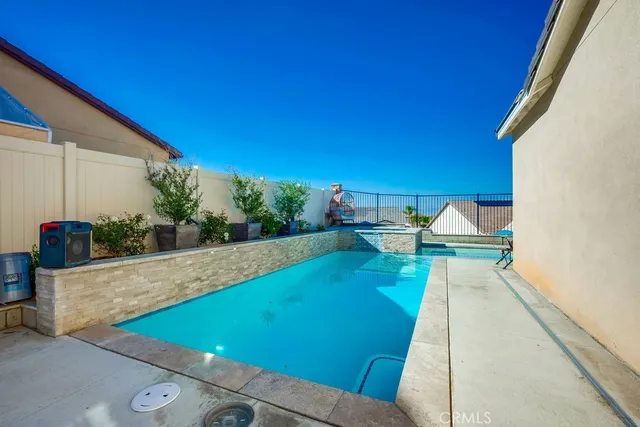 a view of a backyard with potted plants