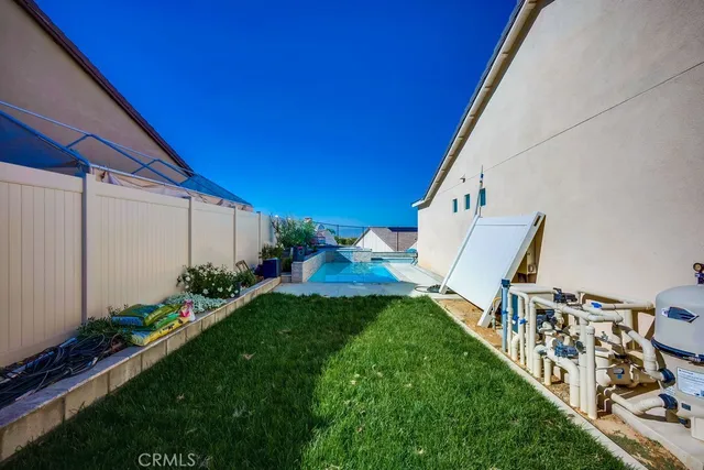 a view of a patio with table and chairs