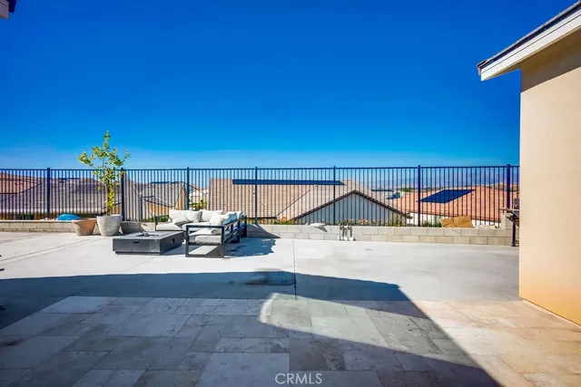 a view of a balcony with chairs