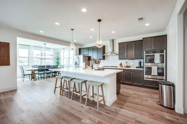 a kitchen with counter top space a sink appliances and cabinets