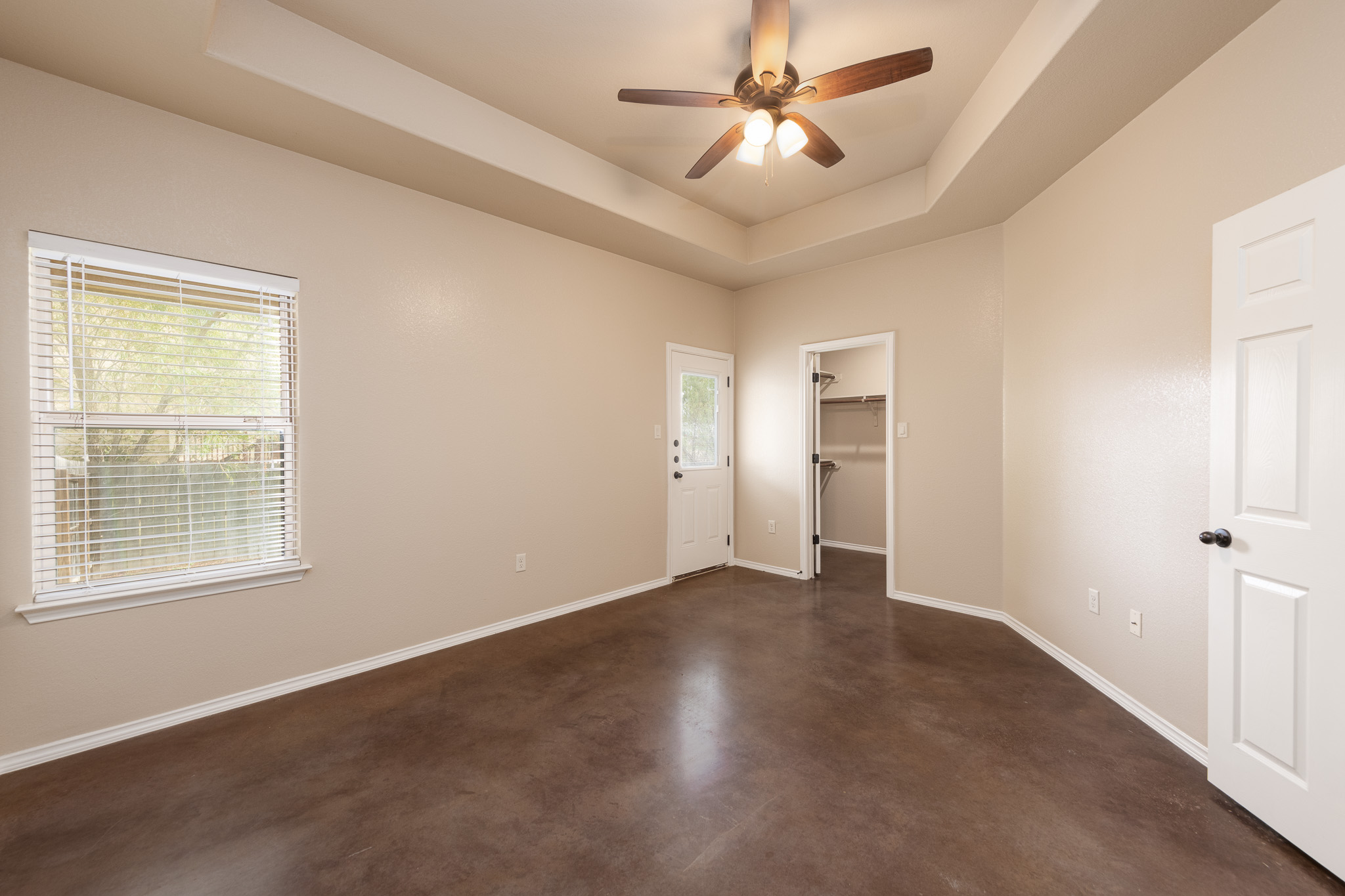 424 Jack Rabbit Lane, Unit B Buda, TX 78610 - Photo 11 of 20 a view of an empty room with a window