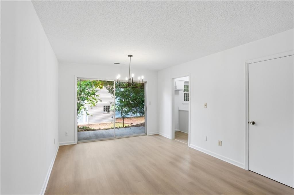 413 Promenade Court Marietta, GA 30064 - Photo 5 of 28 an empty room with a window and mirror