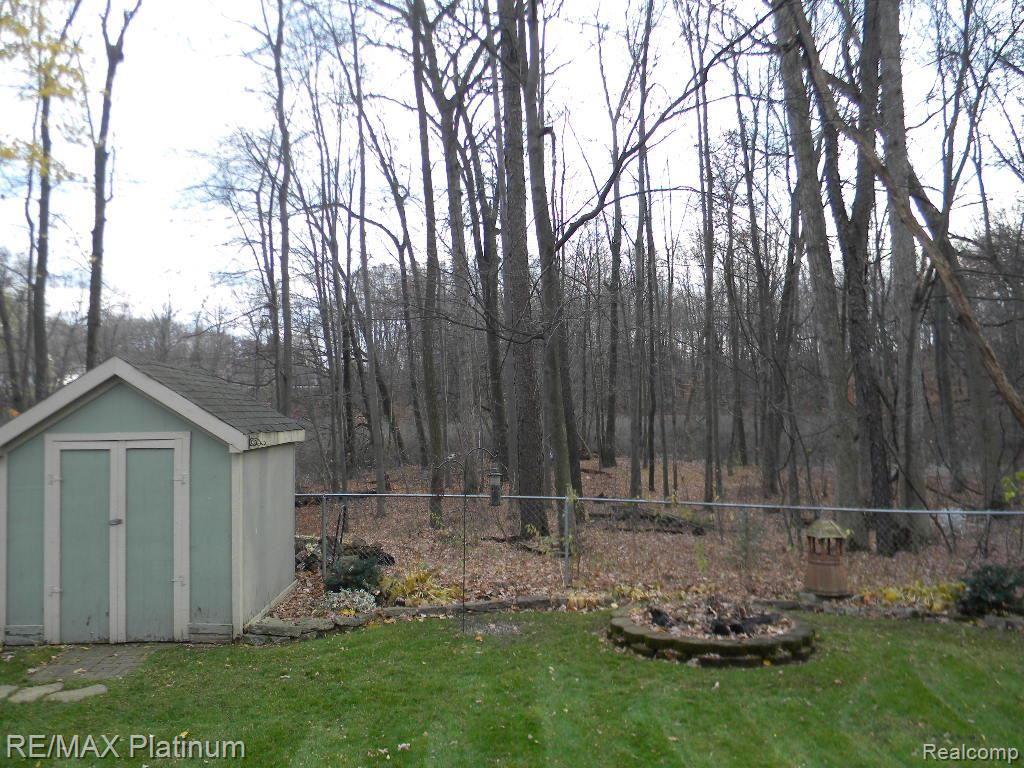 1685 Clark Lake Road Brighton, MI 48114 - Photo 21 of 25 Wooded Natural Setting