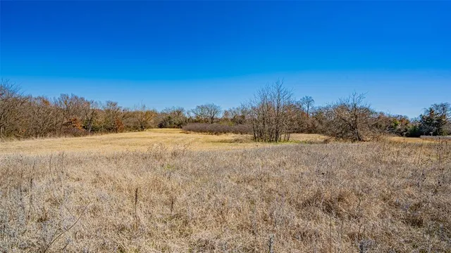 a view of mountain view with trees in the background