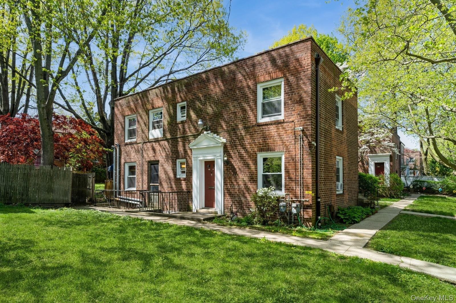 149-32 Union Turnpike, Unit 24A Queens, NY 11367 - Photo 17 of 18 front view of house with a yard