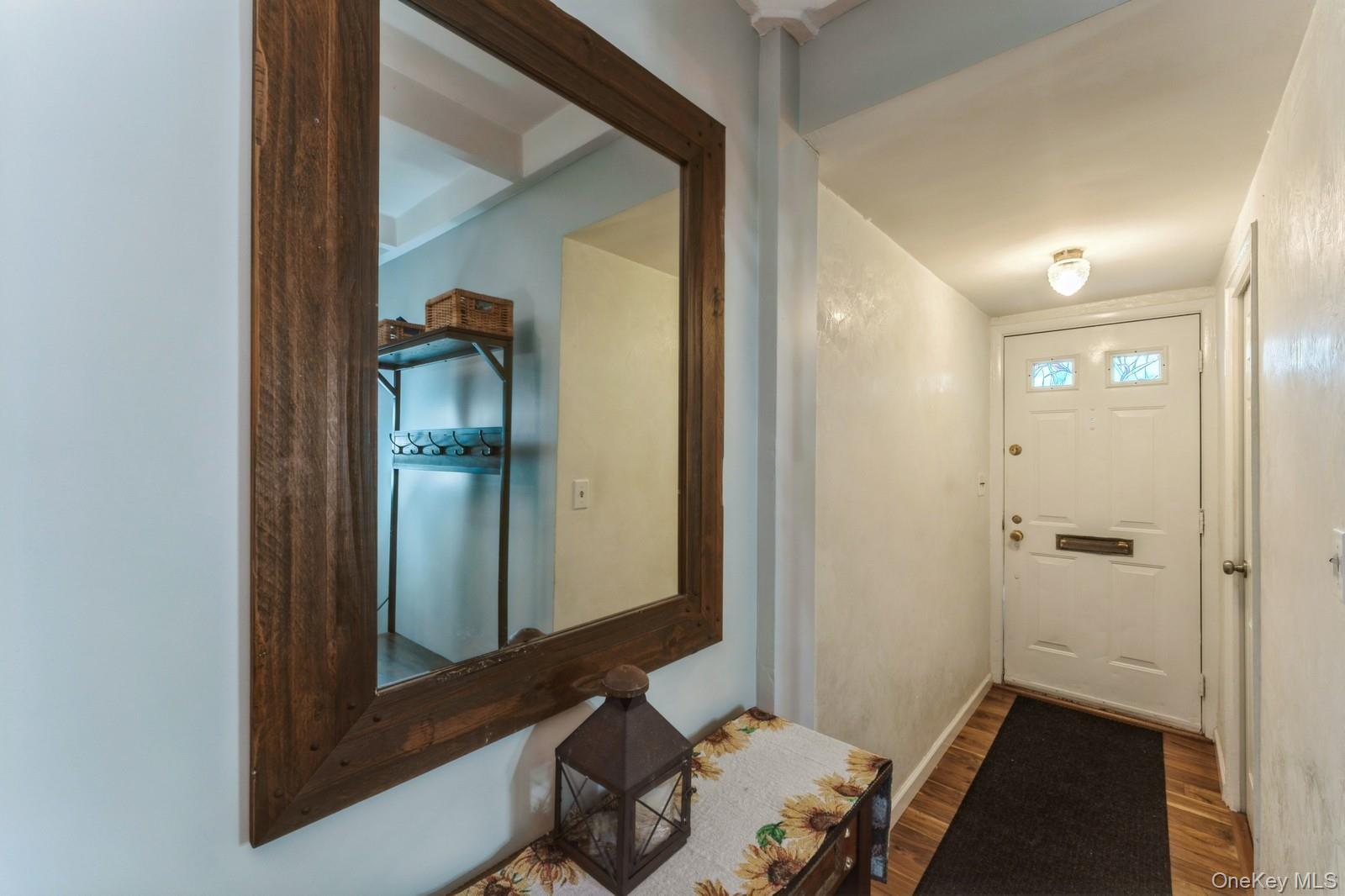 149-32 Union Turnpike, Unit 24A Queens, NY 11367 - Photo 5 of 18 an entryway with a mirror