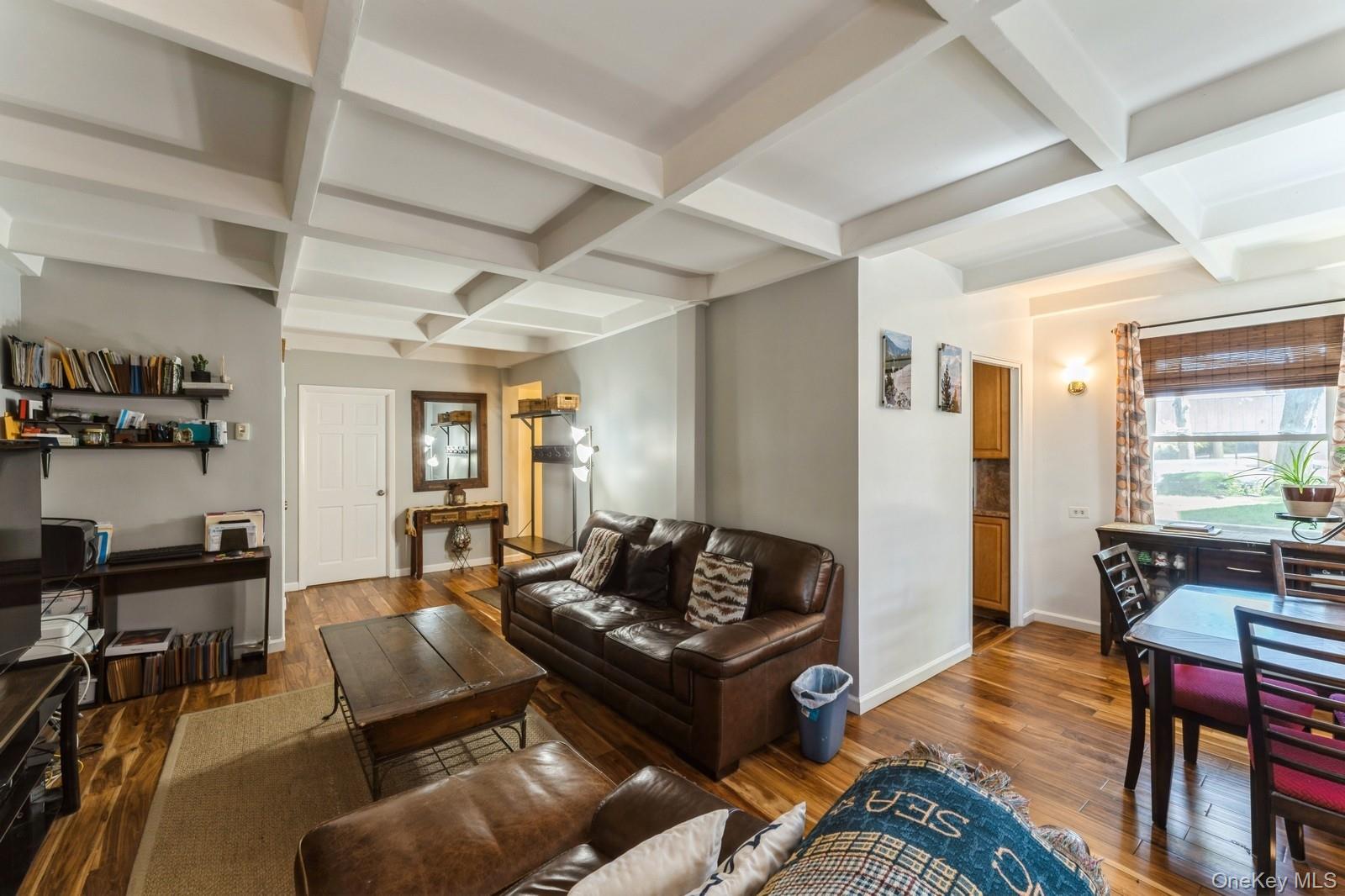 149-32 Union Turnpike, Unit 24A Queens, NY 11367 - Photo 7 of 18 a living room with furniture and wooden floor