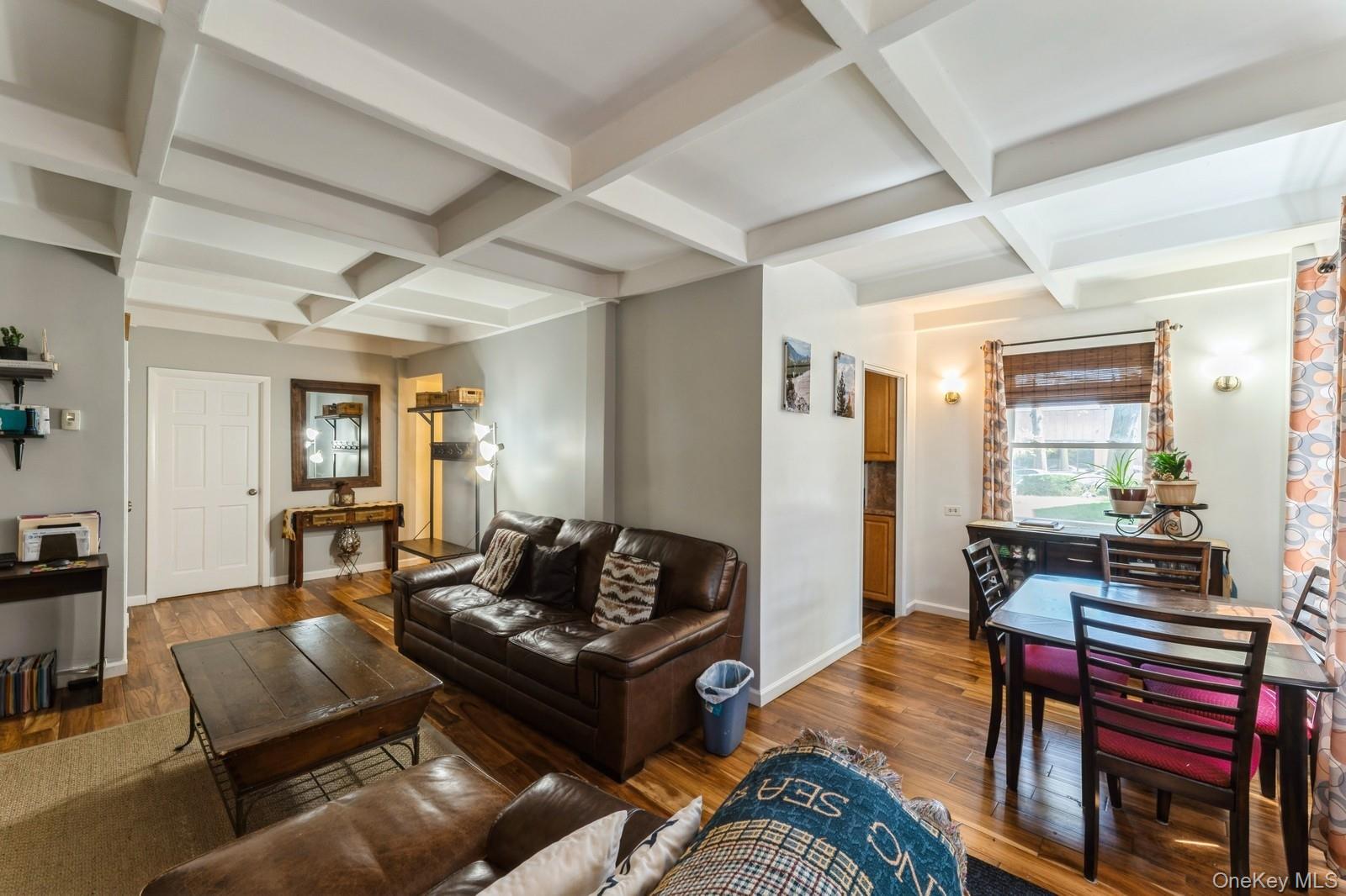 149-32 Union Turnpike, Unit 24A Queens, NY 11367 - Photo 8 of 18 a living room with furniture and wooden floor