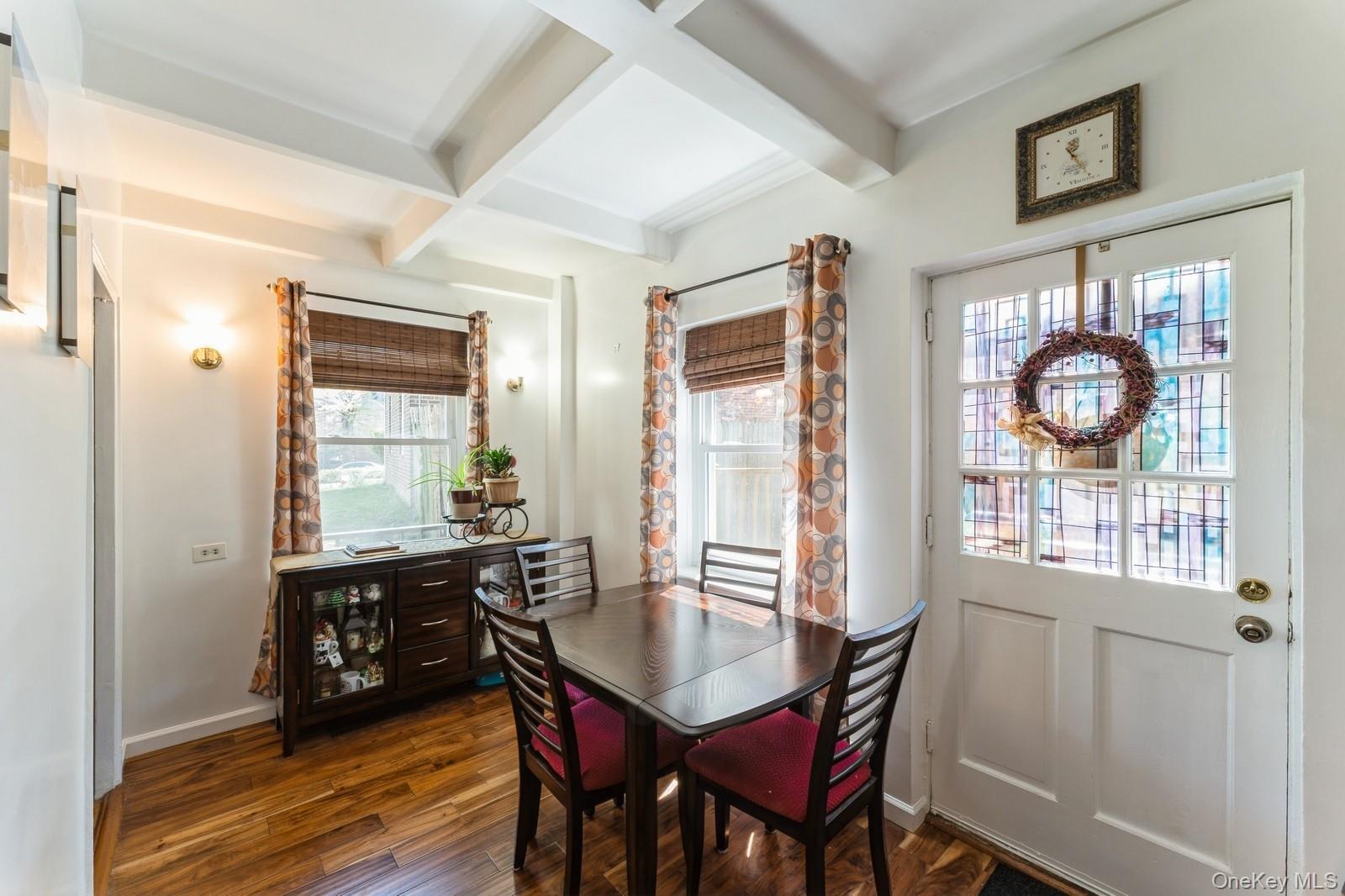 149-32 Union Turnpike, Unit 24A Queens, NY 11367 - Photo 10 of 18 a view of a dining room with furniture and chandelier