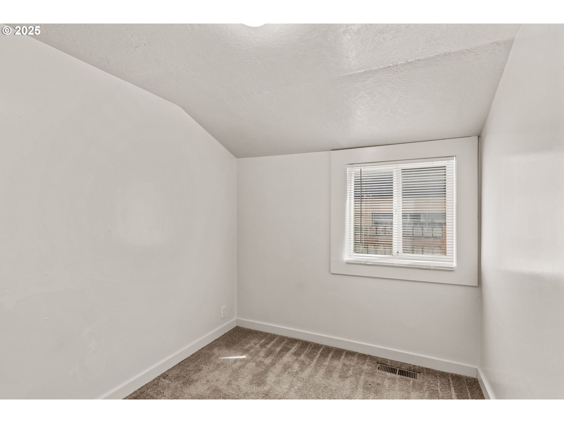1149 Northwest 10th Street Corvallis, OR 97330 - Photo 13 of 29 an empty room with a window