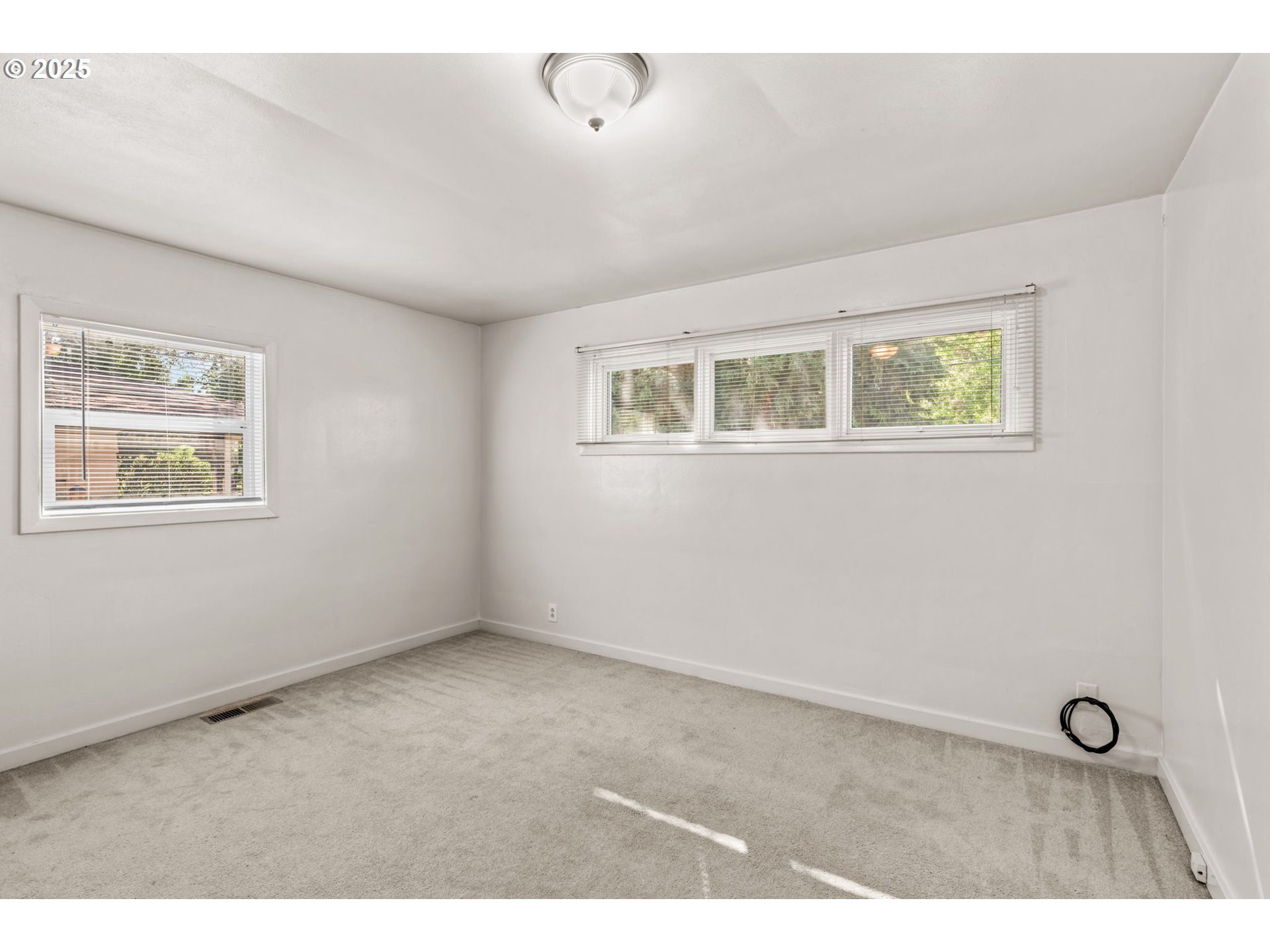 1149 Northwest 10th Street Corvallis, OR 97330 - Photo 14 of 29 a view of an empty room with a window