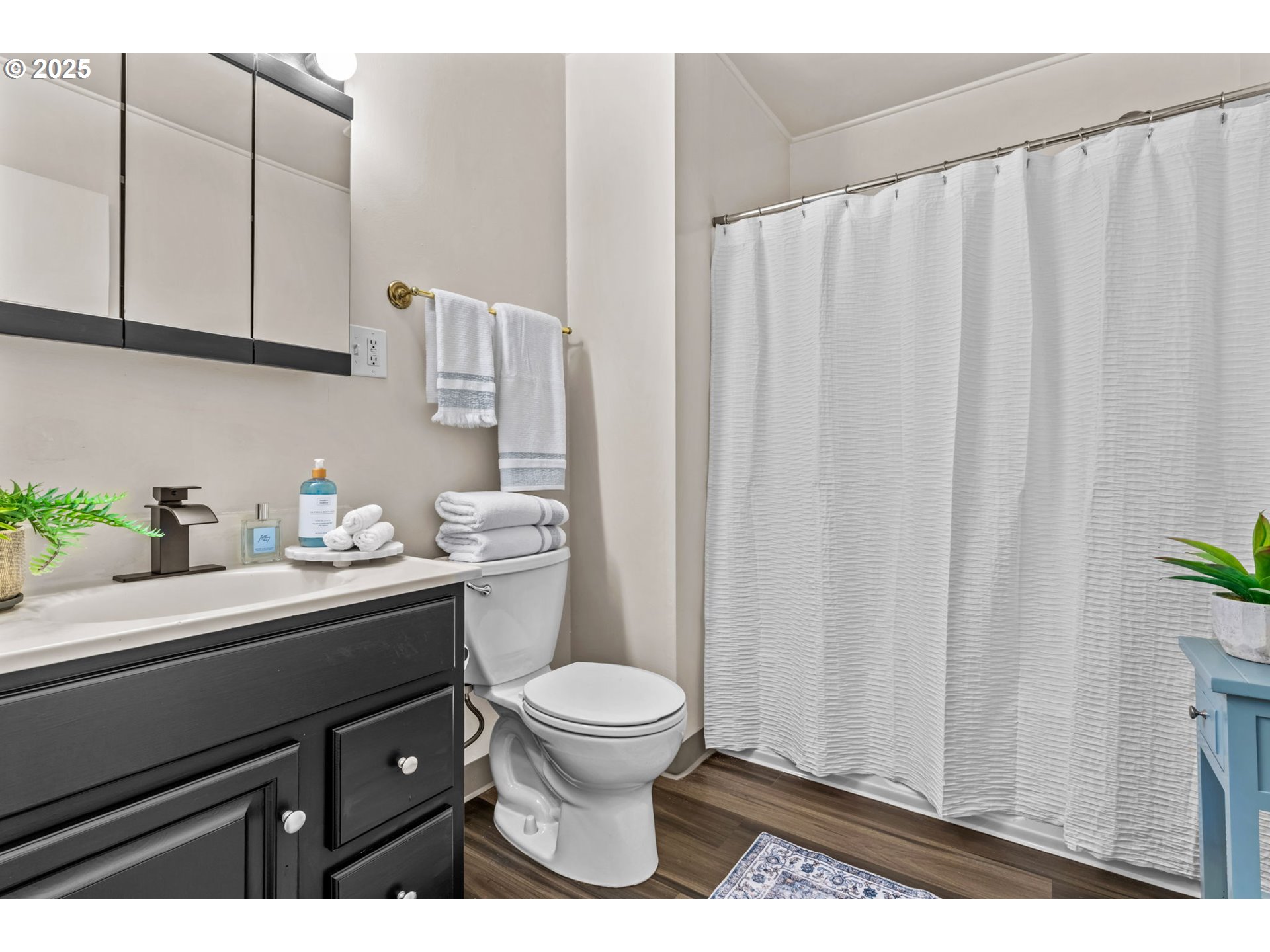 1149 Northwest 10th Street Corvallis, OR 97330 - Photo 17 of 29 a bathroom with a sink a toilet and a mirror