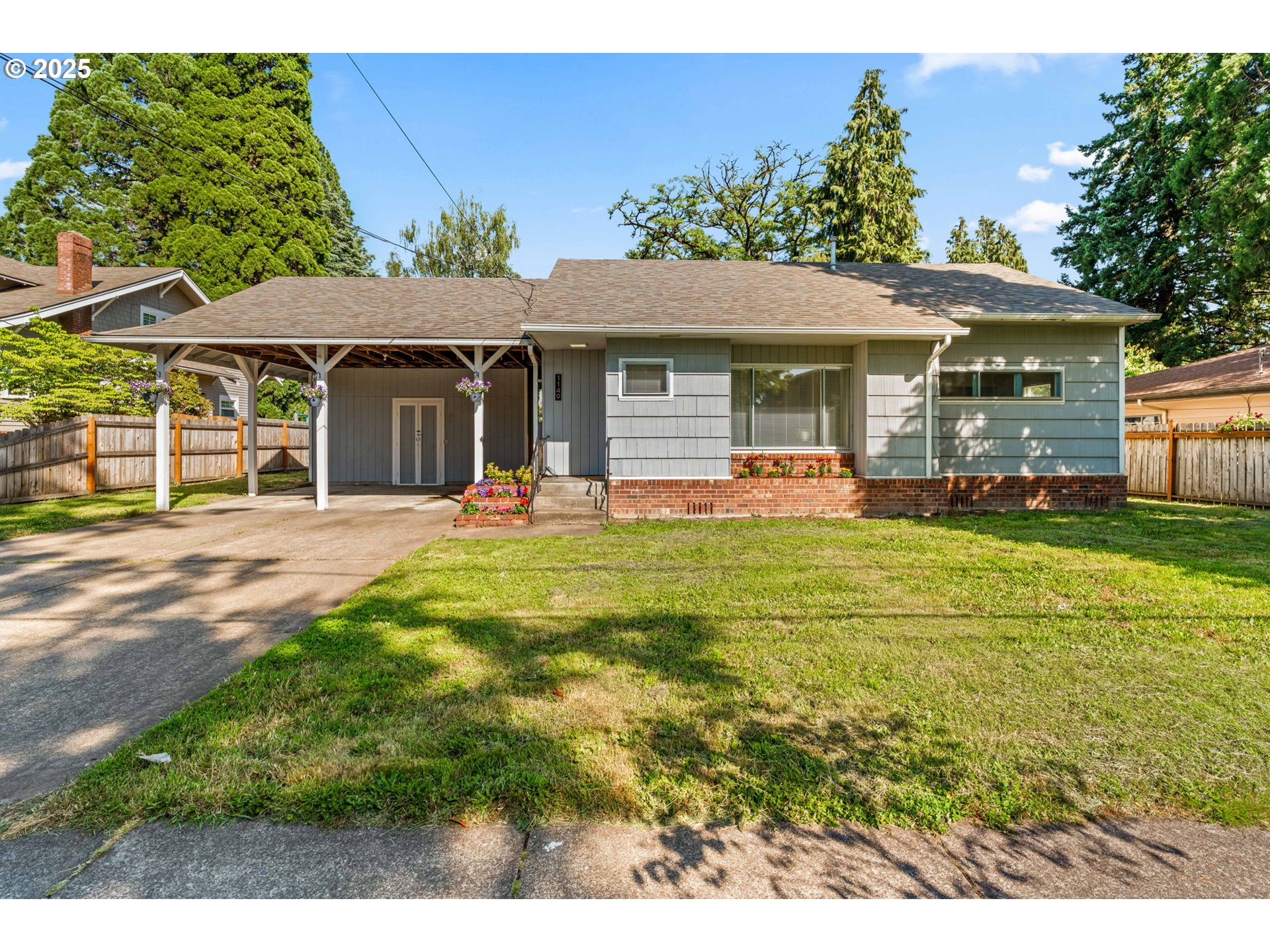 1149 Northwest 10th Street Corvallis, OR 97330 - Photo 3 of 29 a front view of a house with a yard