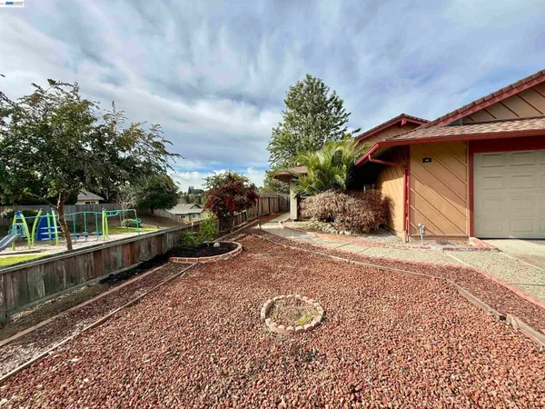 a view of a backyard with sitting area