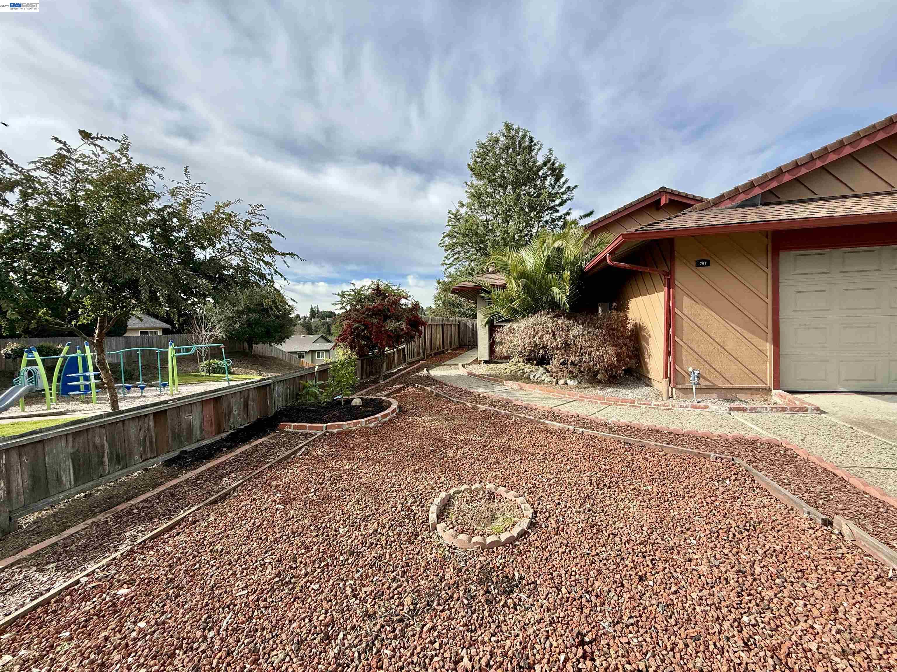 a view of a backyard with sitting area