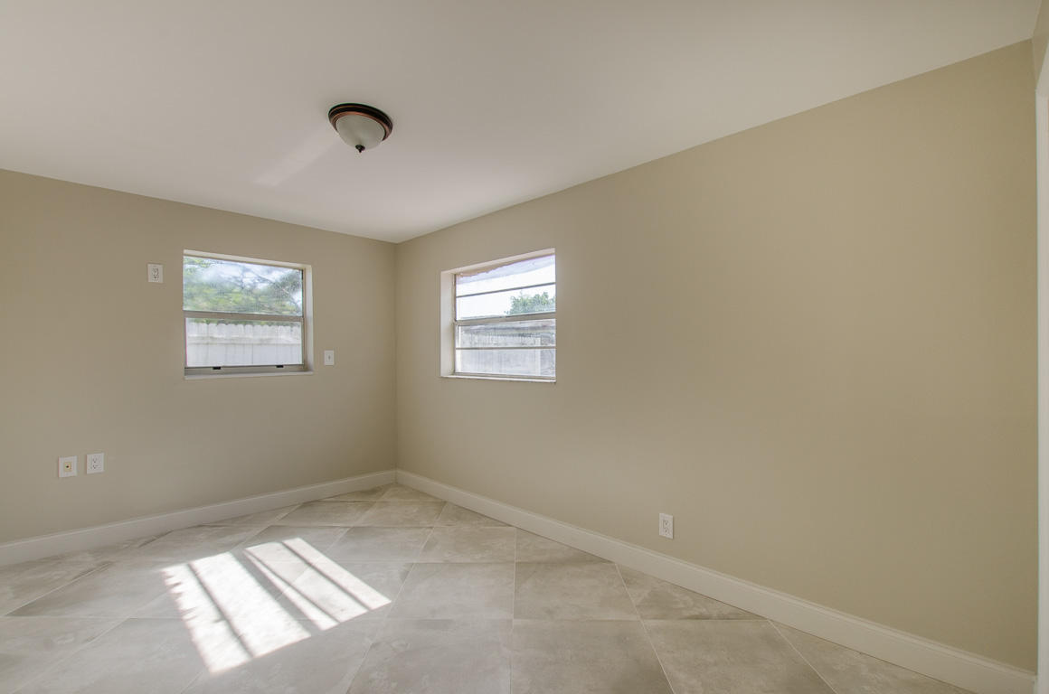 22710 Family Circle Boca Raton, FL 33428 - Photo 22 of 28 an empty room with windows