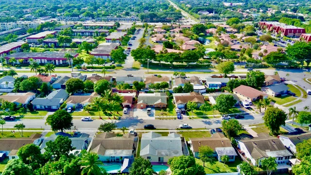 an aerial view of a houses and an outdoor space