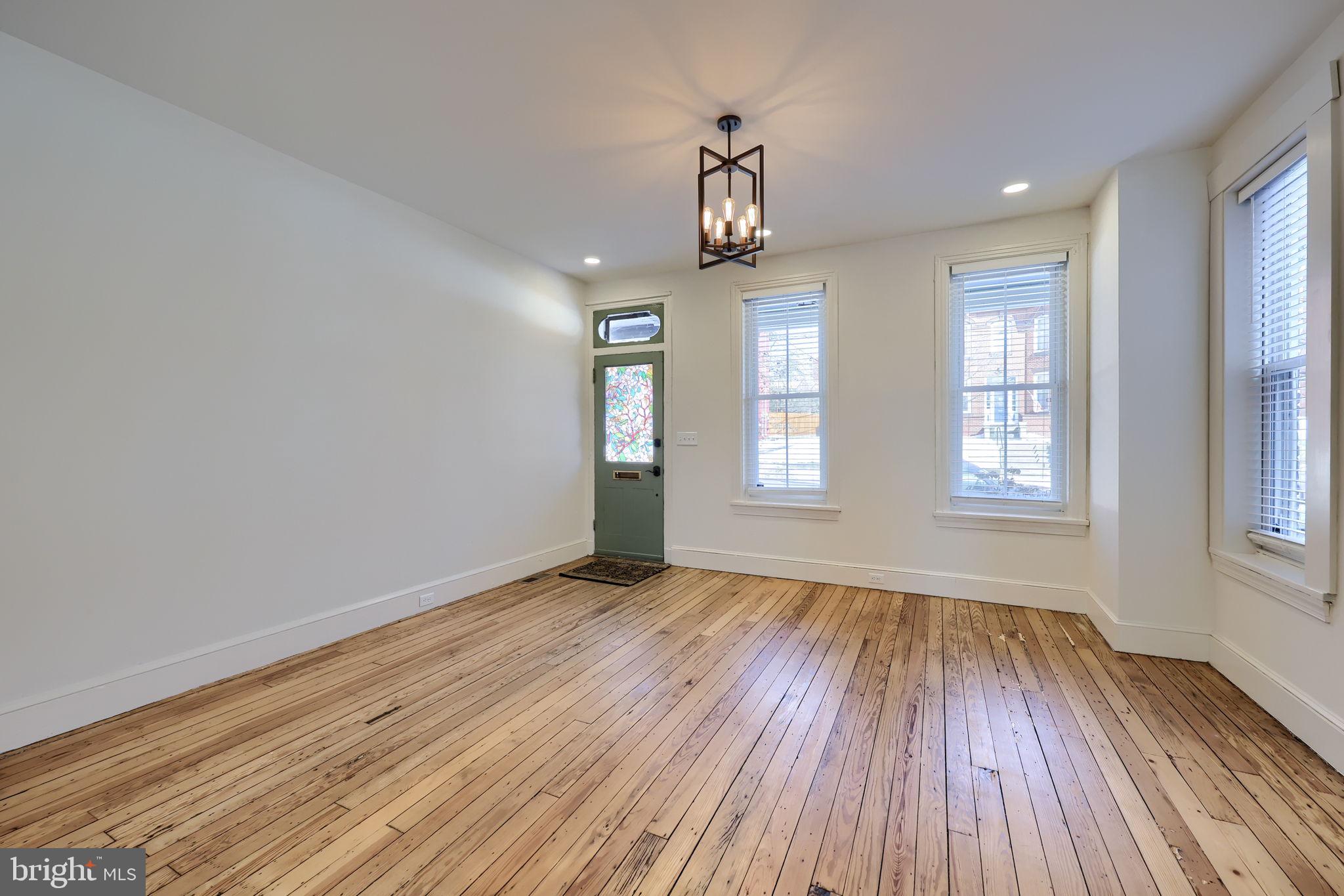 134 South 2nd Street Columbia, PA 17512 - Photo 16 of 47 an empty room with wooden floor and windows