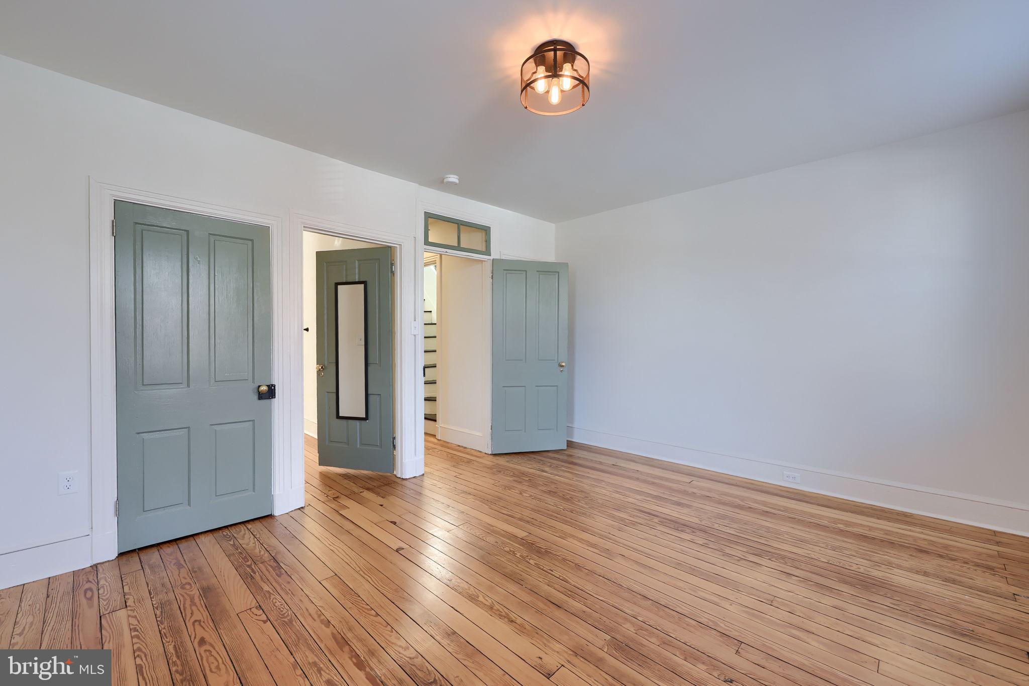 134 South 2nd Street Columbia, PA 17512 - Photo 24 of 47 an empty room with wooden floor and windows