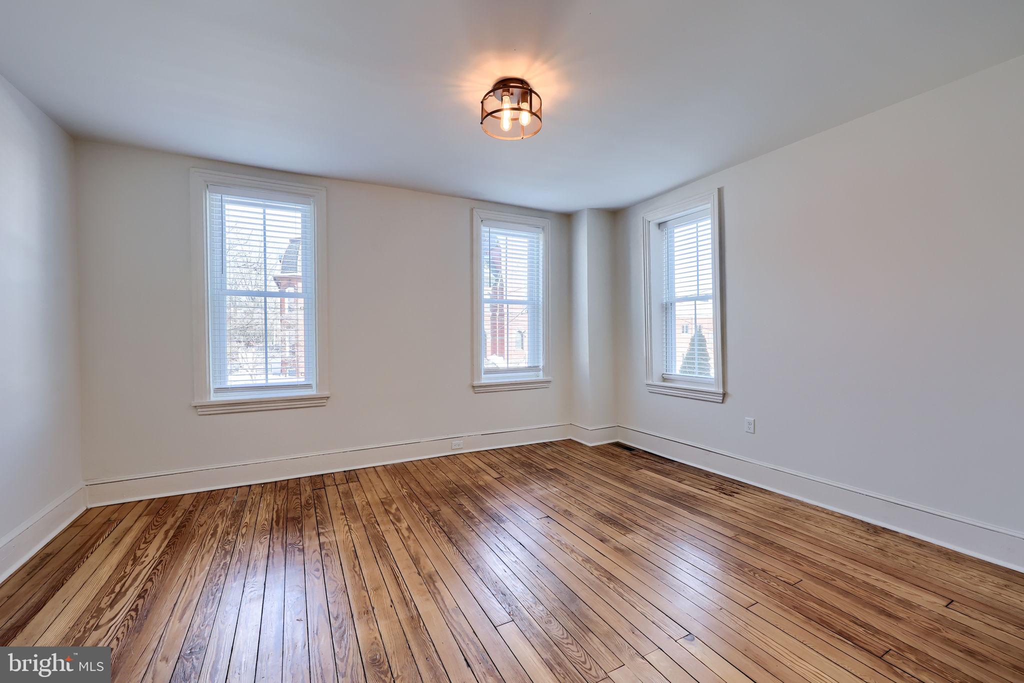 134 South 2nd Street Columbia, PA 17512 - Photo 29 of 47 a view of empty room with wooden floor and fan