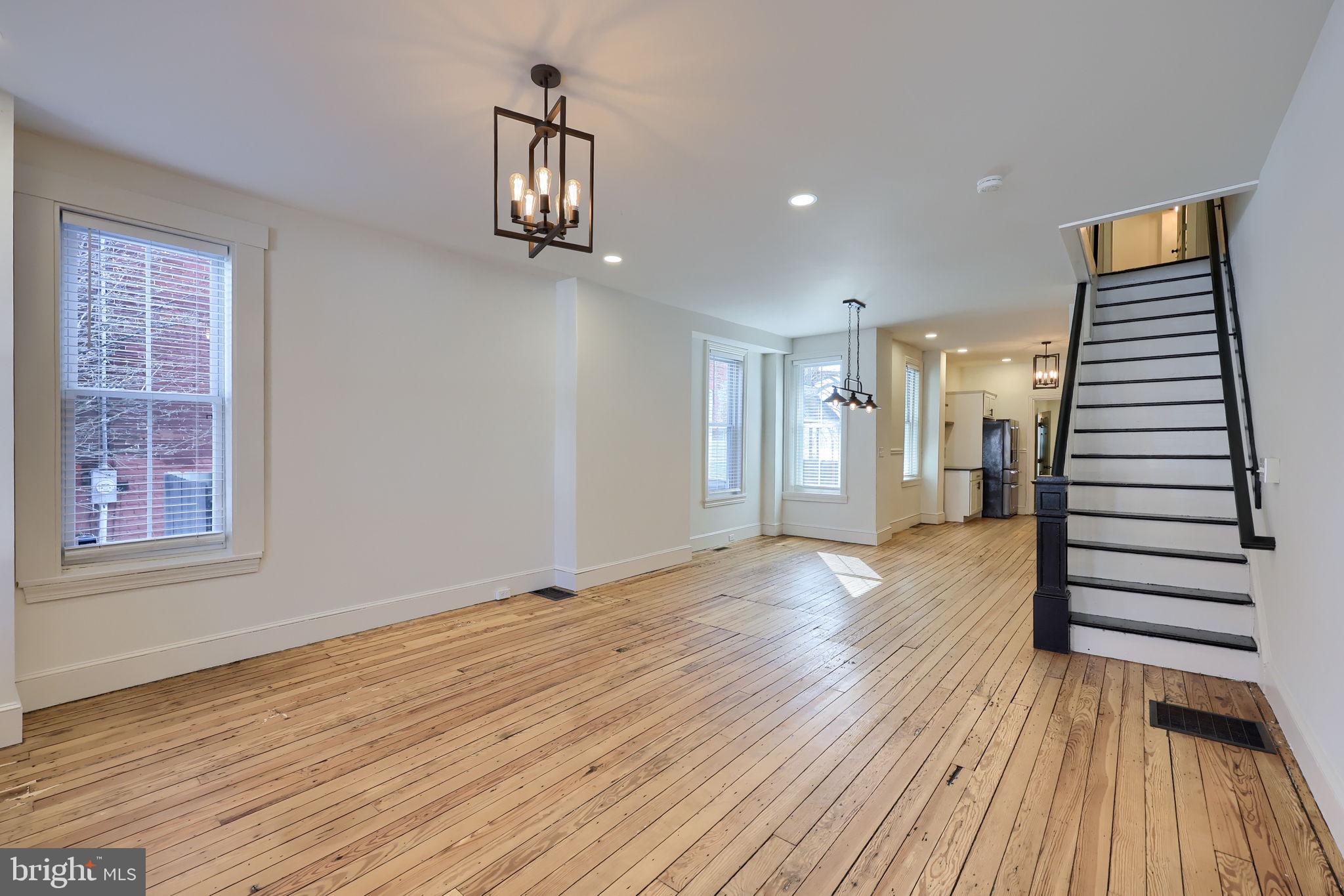 134 South 2nd Street Columbia, PA 17512 - Photo 9 of 47 a view of a room with wooden floor and stairs