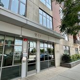 a view of a building with potted plants
