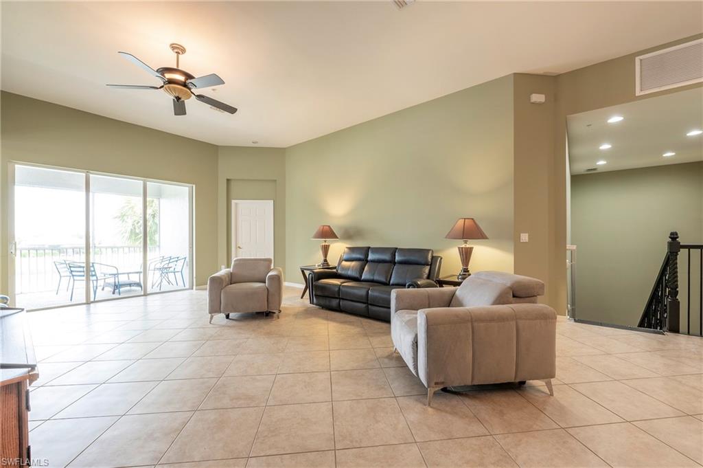 16550 Goldenrod Lane, Unit 201 Fort Myers, FL 33905 - Photo 14 of 45 a living room with furniture and a large window