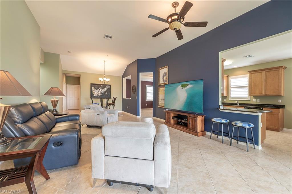 16550 Goldenrod Lane, Unit 201 Fort Myers, FL 33905 - Photo 17 of 45 a living room with furniture and a flat screen tv
