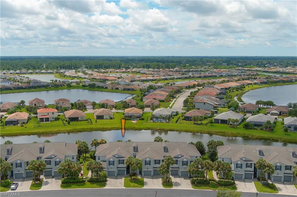 16550 Goldenrod Lane, Unit 201 Fort Myers, FL 33905 - Photo 4 of 45 an aerial view of a city with lots of residential buildings ocean and mountain view in back