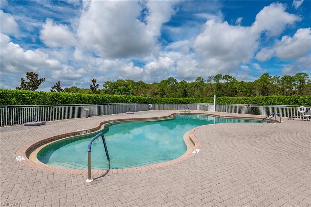 16550 Goldenrod Lane, Unit 201 Fort Myers, FL 33905 - Photo 43 of 45 a view of a swimming pool with a yard