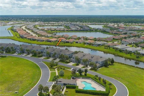 an aerial view of a residential houses with outdoor space