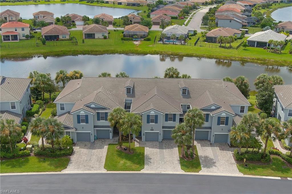 16550 Goldenrod Lane, Unit 201 Fort Myers, FL 33905 - Photo 6 of 45 an aerial view of a house with a yard and lake view