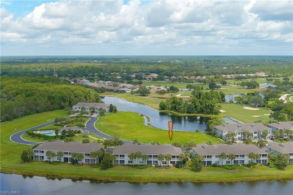 16550 Goldenrod Lane, Unit 201 Fort Myers, FL 33905 - Photo 9 of 45 an aerial view of a house with a garden and lake view