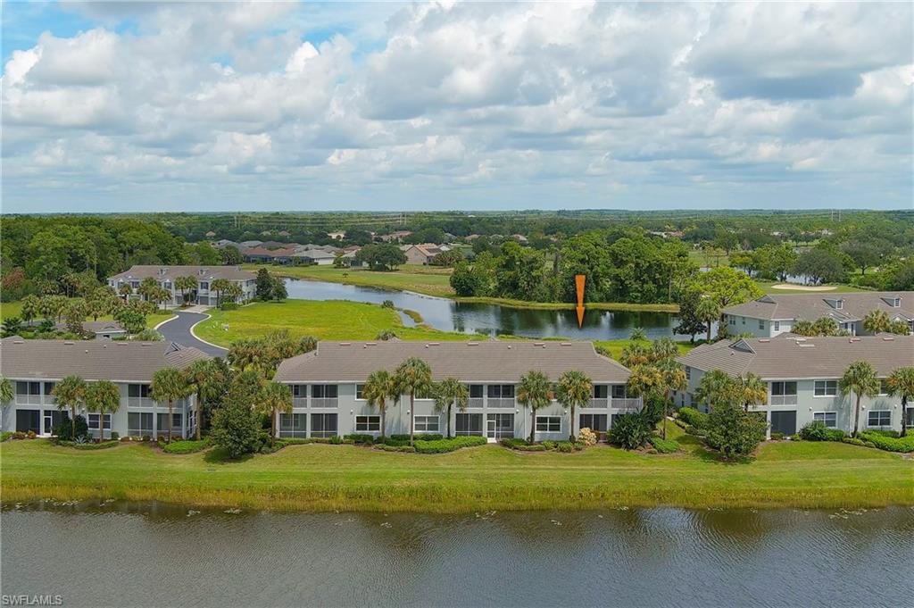 16550 Goldenrod Lane, Unit 201 Fort Myers, FL 33905 - Photo 10 of 45 an aerial view of residential houses with outdoor space and lake view
