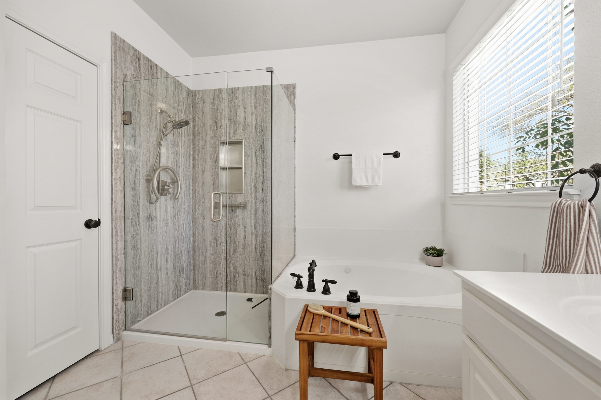 910 Vanguard Street Austin, TX 78734 - Photo 19 of 40 primary bath with walk-in shower and separate tub