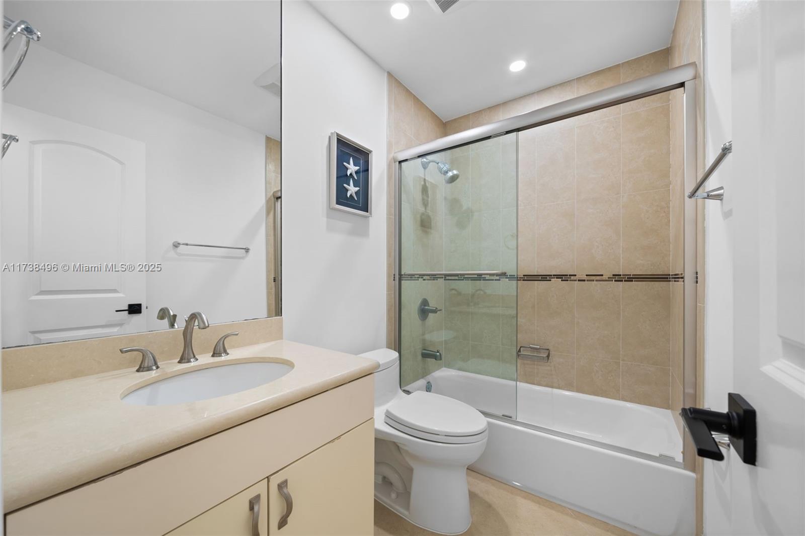 1144 Adams Street Hollywood, FL 33019 - Photo 26 of 51 a bathroom with a sink toilet and shower