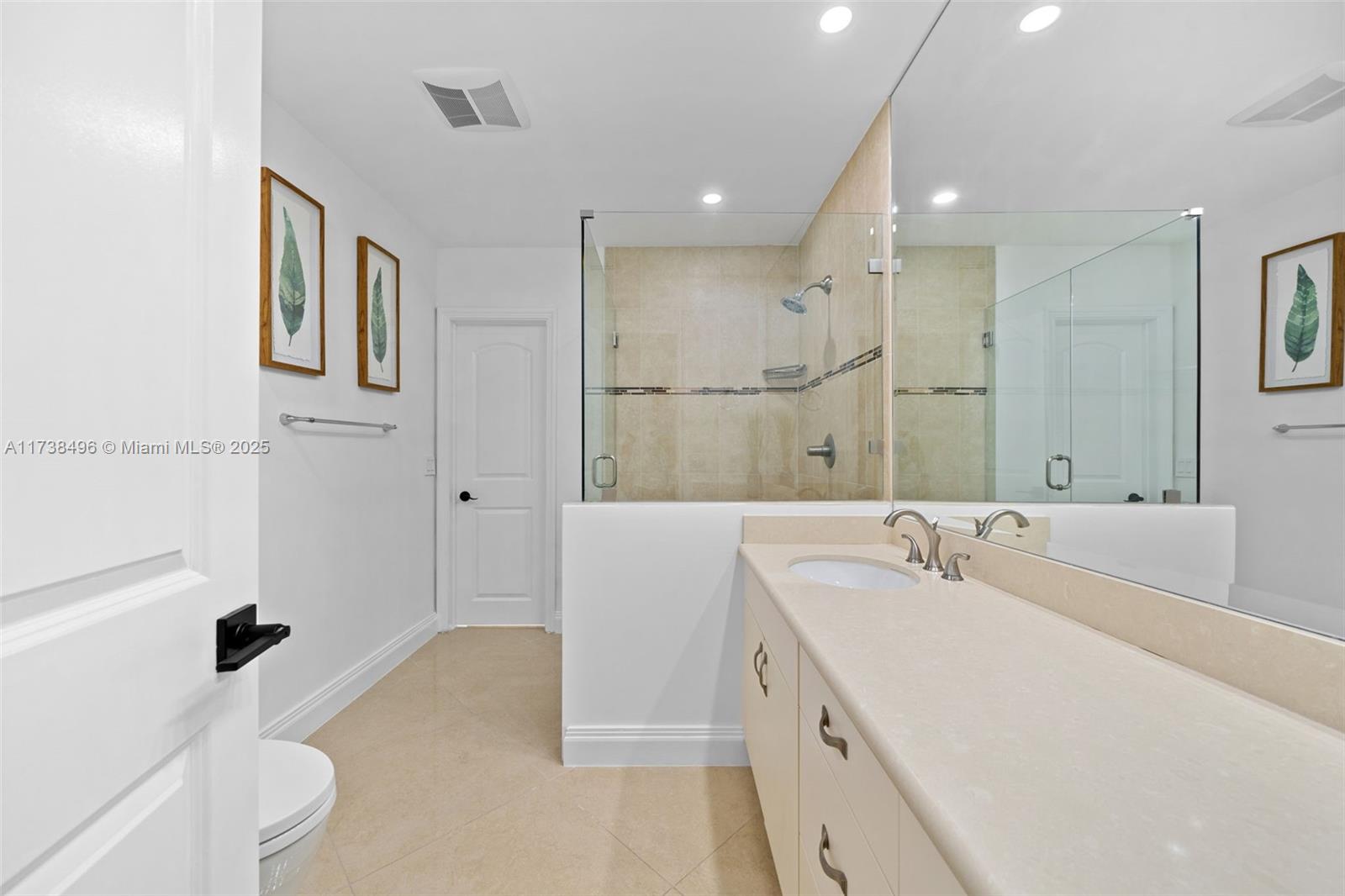 1144 Adams Street Hollywood, FL 33019 - Photo 31 of 51 a bathroom with a tub sink and mirror