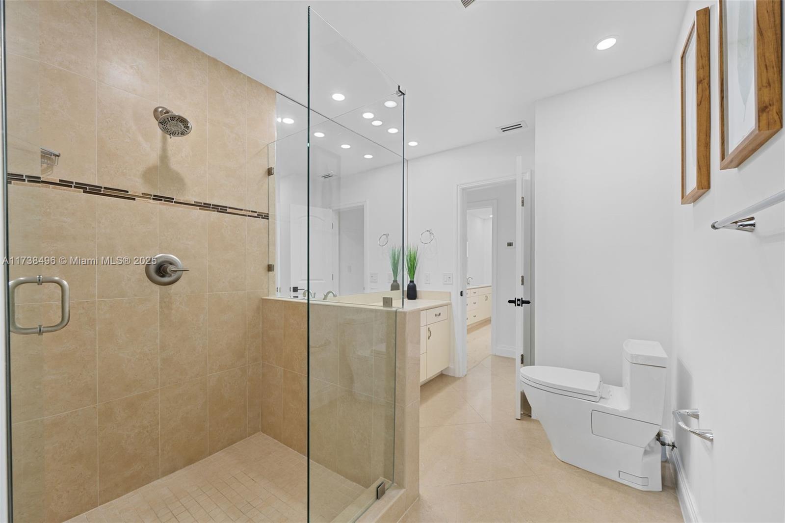 1144 Adams Street Hollywood, FL 33019 - Photo 32 of 51 a bathroom with a shower and toilet