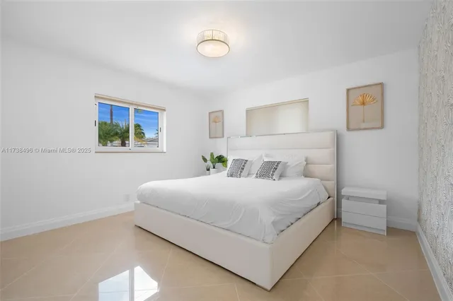 a bathroom with a double vanity sink and mirror