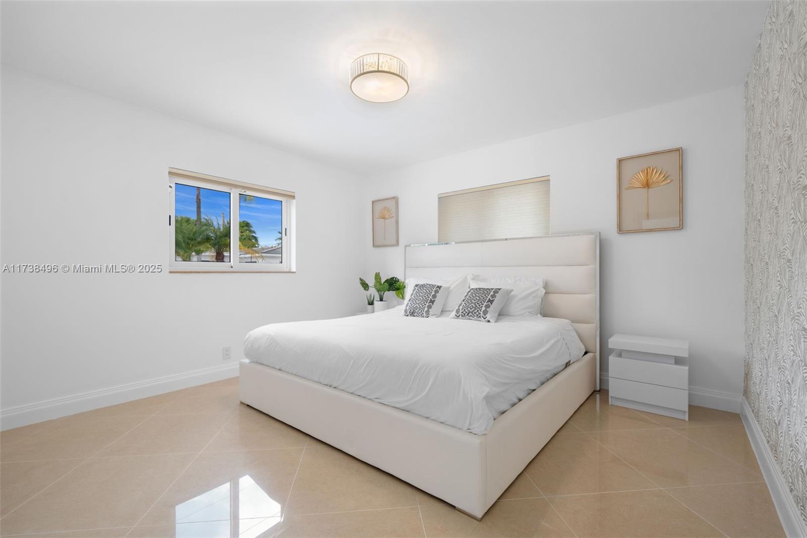 1144 Adams Street Hollywood, FL 33019 - Photo 33 of 51 a bedroom with a bed and window