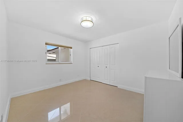 a view of a storage and utility room with washer and dryer