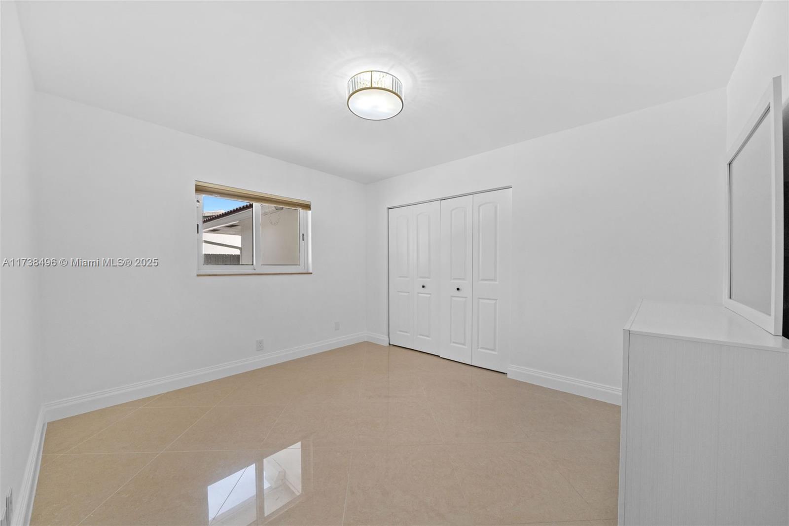 1144 Adams Street Hollywood, FL 33019 - Photo 38 of 51 an empty room with windows